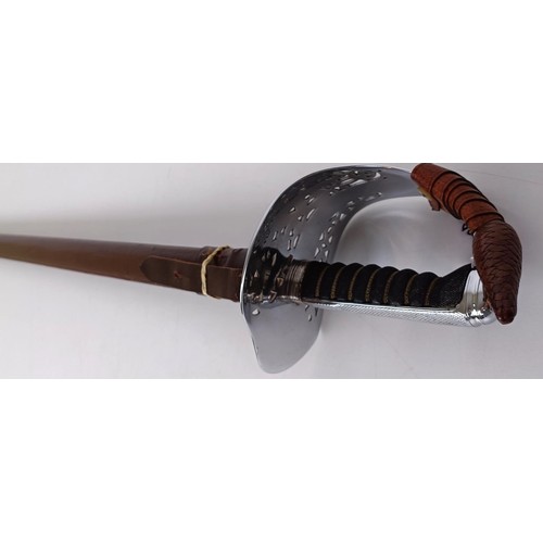 280 - An Edward VII officer's sword, with a wire bound fishskin grip, in a leather mounted scabbard