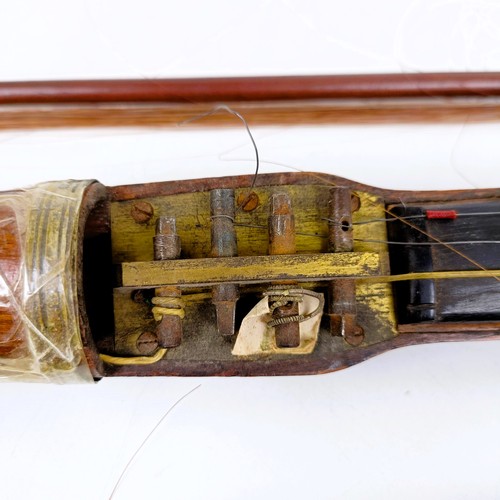 500 - A rare 19th century mahogany novelty walking stick violin, the bow (with an ivory frog) stored in th... 