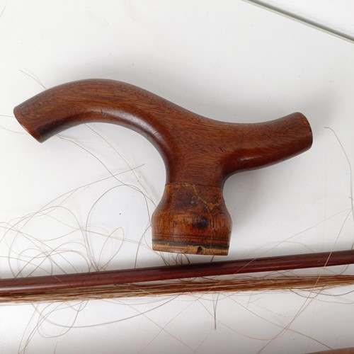 500 - A rare 19th century mahogany novelty walking stick violin, the bow (with an ivory frog) stored in th... 