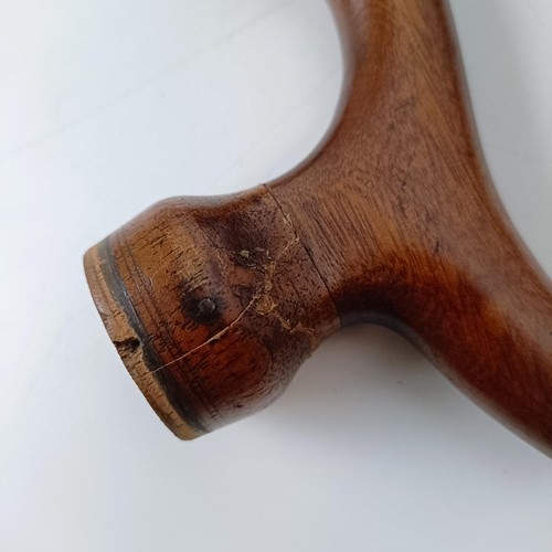 500 - A rare 19th century mahogany novelty walking stick violin, the bow (with an ivory frog) stored in th... 