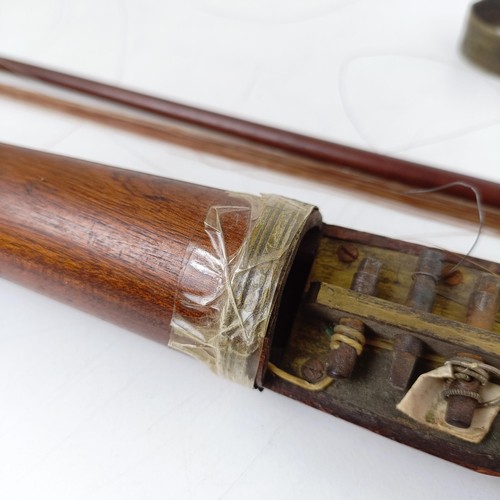 500 - A rare 19th century mahogany novelty walking stick violin, the bow (with an ivory frog) stored in th... 