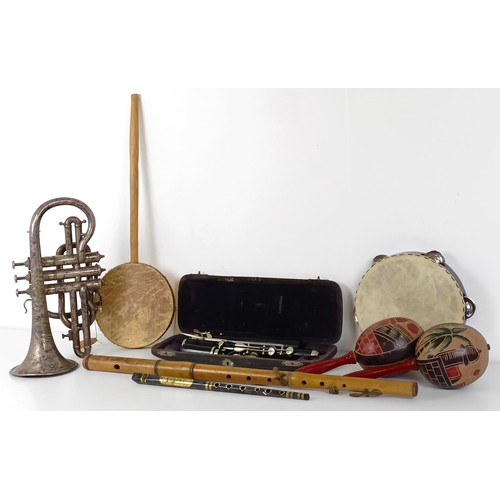 501 - A silver plated cornet, a pair of maracas, a tambourine, a part of a flute (one ivory piece has been... 