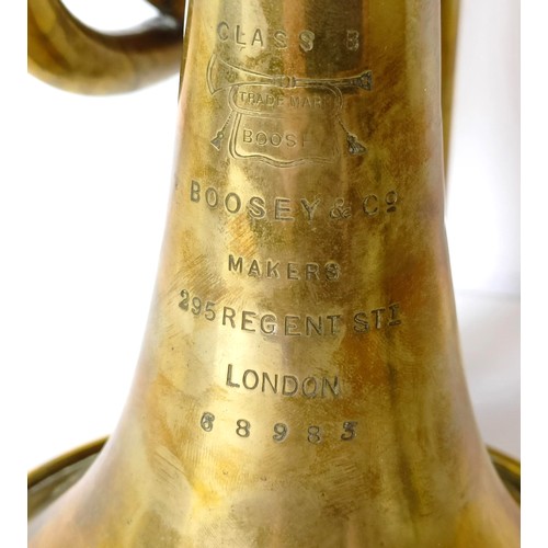 502 - A brass cornet, by Boosey & Co, London, No 88983, in a hardwood case