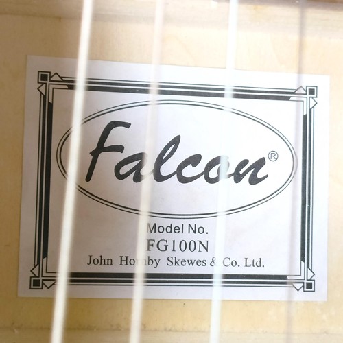 511 - A Falcon acoustic guitar, No FG100N, in a Kinsman hard case