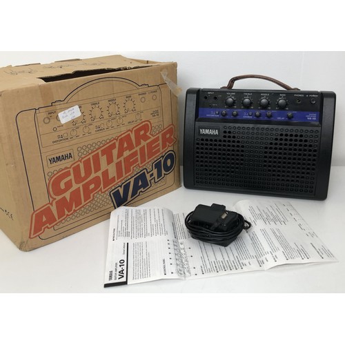 512 - A Burns electric guitar, Club Series, No 9911635, in a cloth case, with a portable amp