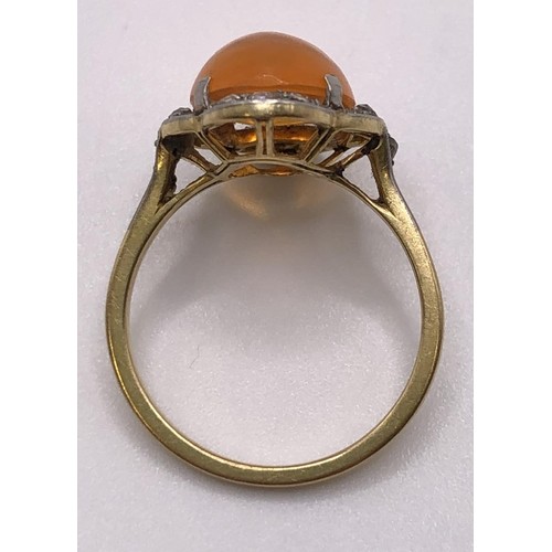 780 - An Art Deco 18ct gold and fire opal ring, ring size N