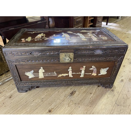 924 - A Chinese trunk, inset with hardstones, decorated figures, 89 cm wide