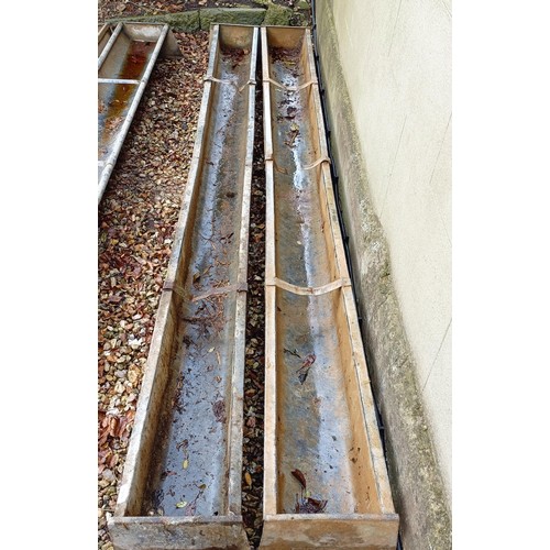 1054 - Two trough feeders, 218 cm long