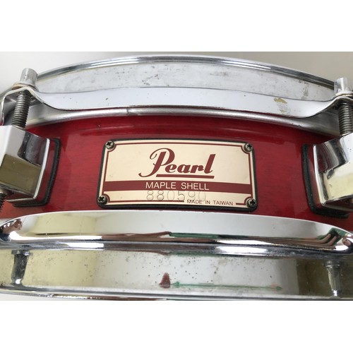 521 - A Pearl piccolo side drum, 13 inches, in a soft carry case, two tambourines, a Bodran, a ukulele, a ... 