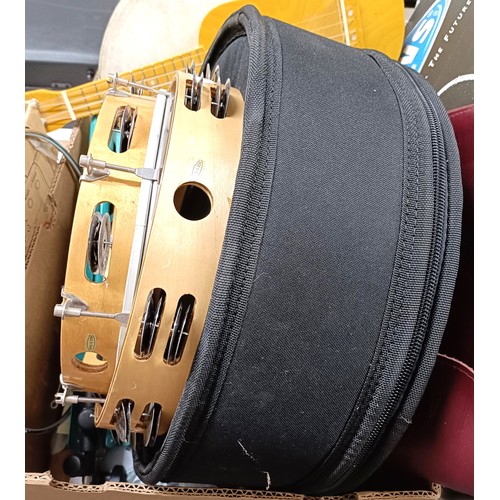 521 - A Pearl piccolo side drum, 13 inches, in a soft carry case, two tambourines, a Bodran, a ukulele, a ... 