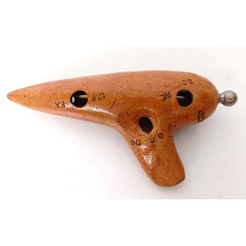 531 - A pottery ocarina, by E Mezzetti of Paris