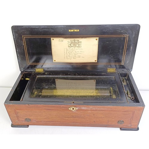 535 - An eight air music box, in a rosewood case, 50 cm wide