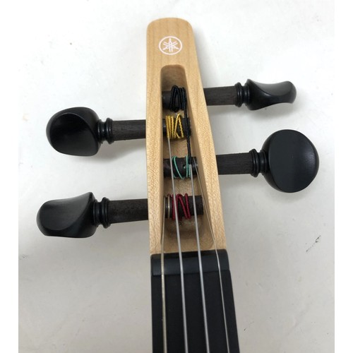 515 - A Yamaha electric violin, No YEV-104, with instructions, very lightly used, with a hard Stentor trav... 