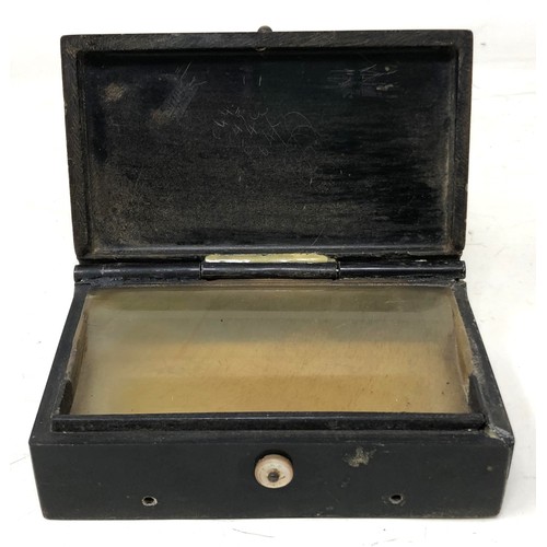 534 - A late 19th early/20th century music box, in pieces, in a carved ebony case, decorated military scen... 