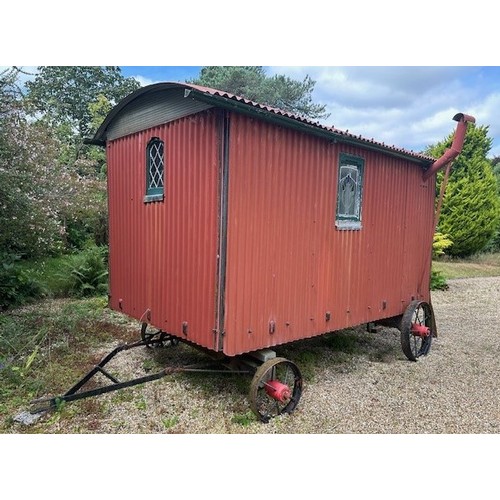 550 - A shepherd's style hut, removed from a Country House near Fordingbridge, with a draw bar, steps and ... 