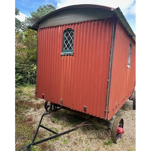 550 - A shepherd's style hut, removed from a Country House near Fordingbridge, with a draw bar, steps and ... 