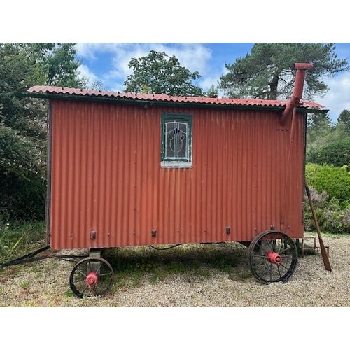 550 - A shepherd's style hut, removed from a Country House near Fordingbridge, with a draw bar, steps and ... 