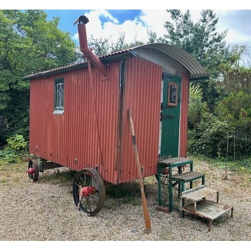 550 - A shepherd's style hut, removed from a Country House near Fordingbridge, with a draw bar, steps and ... 