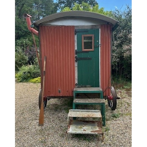 550 - A shepherd's style hut, removed from a Country House near Fordingbridge, with a draw bar, steps and ... 