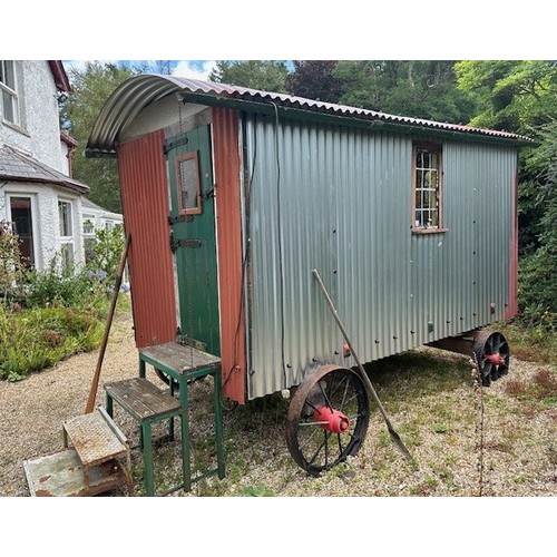 550 - A shepherd's style hut, removed from a Country House near Fordingbridge, with a draw bar, steps and ... 