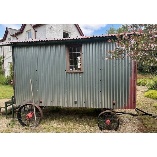 550 - A shepherd's style hut, removed from a Country House near Fordingbridge, with a draw bar, steps and ... 