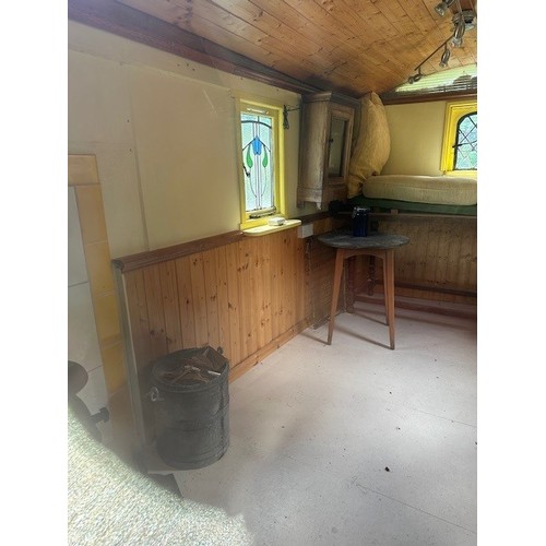 550 - A shepherd's style hut, removed from a Country House near Fordingbridge, with a draw bar, steps and ... 