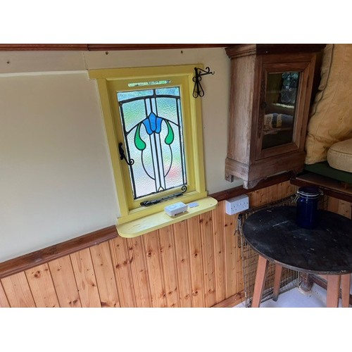 550 - A shepherd's style hut, removed from a Country House near Fordingbridge, with a draw bar, steps and ... 