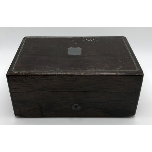 537 - A 19th century music box, plating four airs, in a rosewood case, 14 cm wide