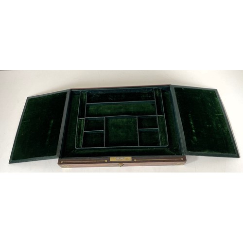 554 - A 19th century rosewood and brass bound jewellery box, the hinged top to reveal a mirror and two fit... 