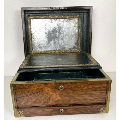 554 - A 19th century rosewood and brass bound jewellery box, the hinged top to reveal a mirror and two fit... 