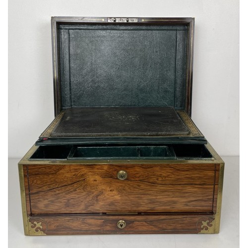 554 - A 19th century rosewood and brass bound jewellery box, the hinged top to reveal a mirror and two fit... 