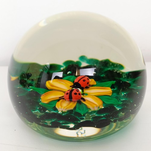 655 - A Caithness glass paperweight, and five other glass paperweights (6)