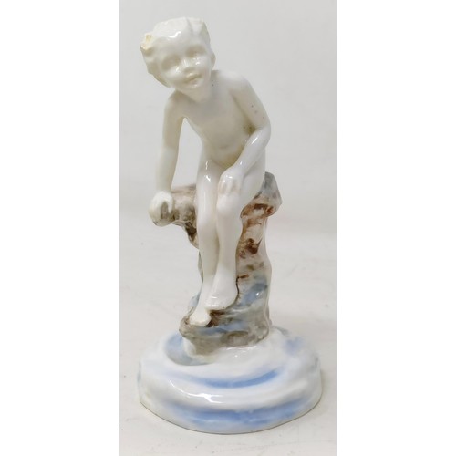 661 - A Royal Worcester figure, of a boy perched on a rock, 15 cm high, another with a cane, 15 cm high, a... 