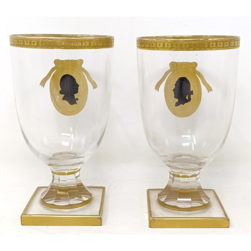 663 - A pair of goblets, highlighted in gilt, decorated silhouette portraits of Wagner and Lavater, 13 cm ... 