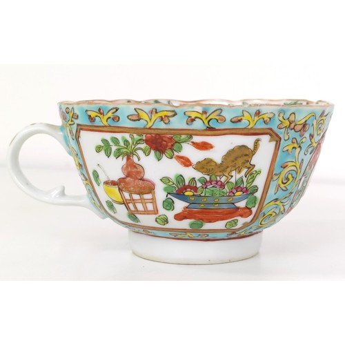 664 - A Chinese famille rose cup and saucer