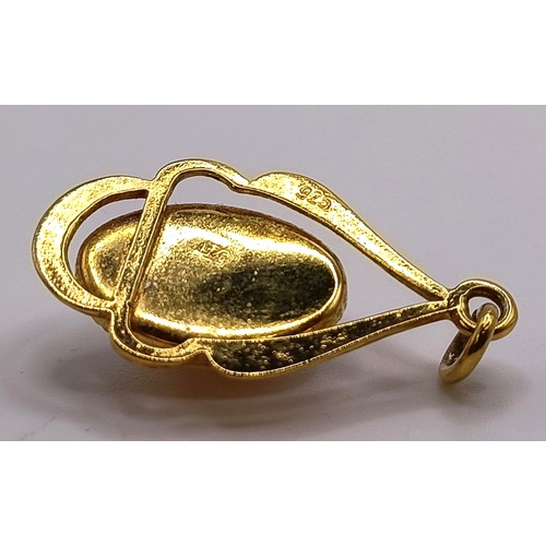 749 - A silver gilt and opal pendant