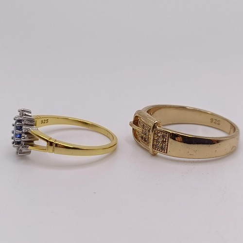 750 - A gilt metal and white stone belt ring, and a silver gilt and gem set ring (2)