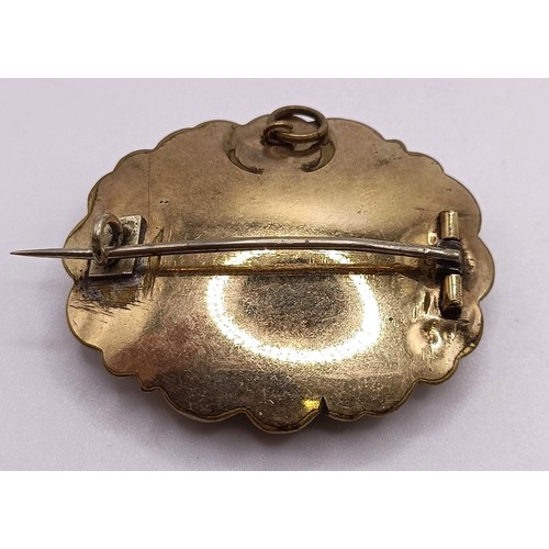 767 - A Victorian gilt metal mourning brooch