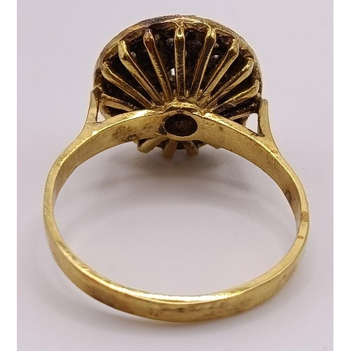 797 - A gilt metal and white stone ring, and a gold plated flower brooch (2)