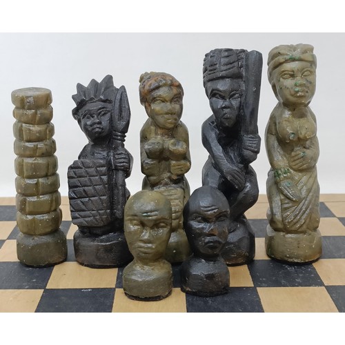 567 - An African carved wooden chess set, another, a small album of postcards, assorted desk and other ite... 