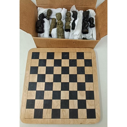 567 - An African carved wooden chess set, another, a small album of postcards, assorted desk and other ite... 