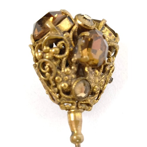 823 - A gilt metal, opal and white stone hairpin, and four other hairpins