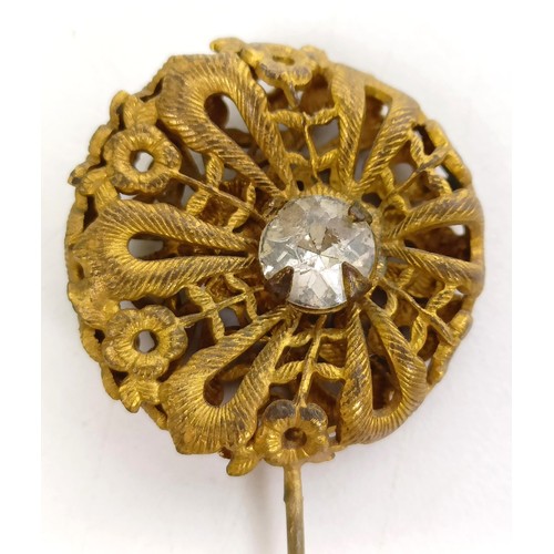 823 - A gilt metal, opal and white stone hairpin, and four other hairpins