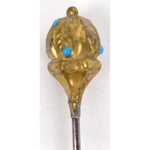 823 - A gilt metal, opal and white stone hairpin, and four other hairpins