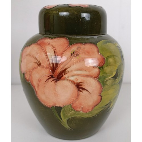 581 - A Moorcroft lamp, decorated flowers, a ginger jar, and two bowls (4)