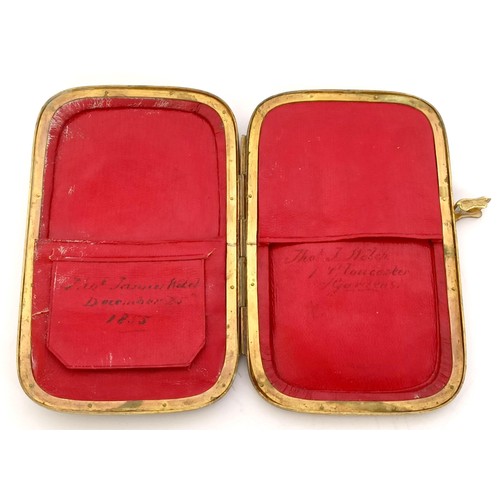 841 - A Victorian leather and brass purse, of rounded rectangular form, applied an oval porcelain plaque, ... 