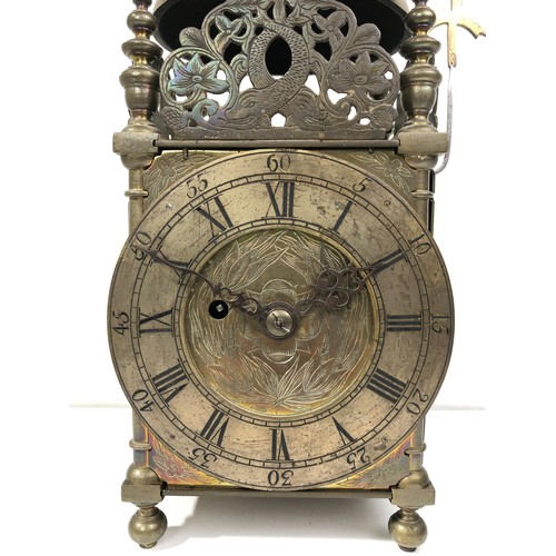 853 - A 17th century style lantern clock, with a single fusee movement striking on a bell, in a brass case... 