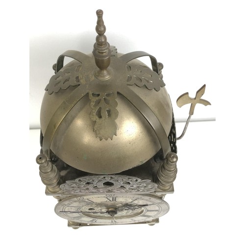 853 - A 17th century style lantern clock, with a single fusee movement striking on a bell, in a brass case... 