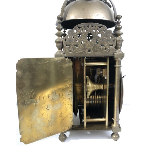 853 - A 17th century style lantern clock, with a single fusee movement striking on a bell, in a brass case... 