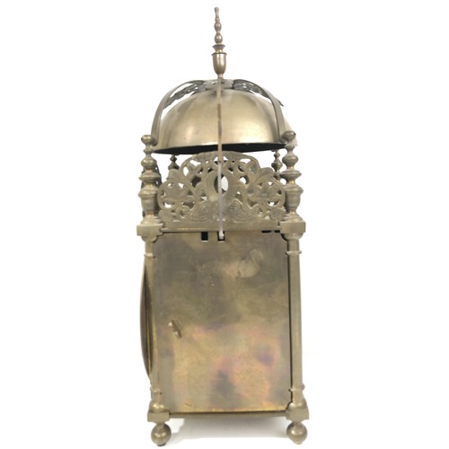 853 - A 17th century style lantern clock, with a single fusee movement striking on a bell, in a brass case... 